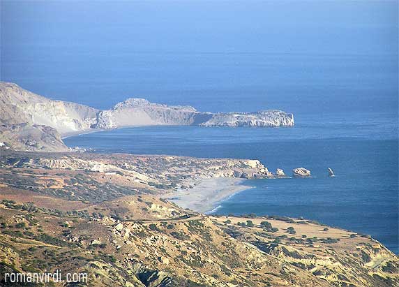 View onto Triopetra: The Three Rocks in the Sea. Triopetra Beach is just in the bay behind the rocks. The long sandy strip which is visible beyond it is Agios Pavlos Beach