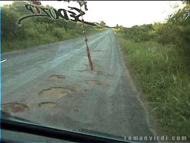 Potholed road, but our driver was an expert at avoiding them!