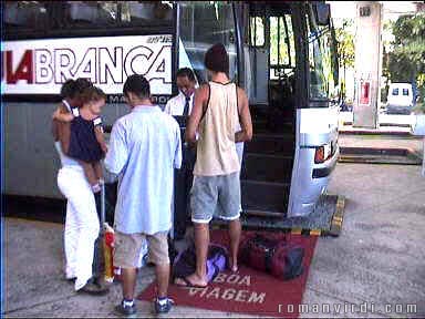Entering Aguia Branca bus to Ilheus over red carpet