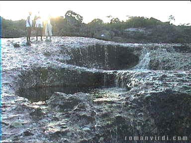 Water cascades into holes of Serrano
