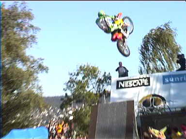 FMX, 2002. This rider's just taken off at high speed from the ramp (gray track with brown sides at lower center)