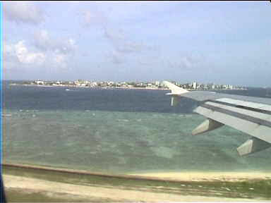 Landing on the "airport island". The other island with buildings is Male, the capital