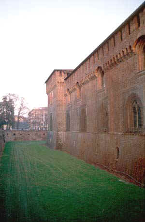 The dried-out green moat of a Milan castle