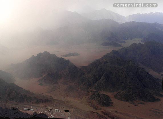 A sandstorm approaching these desert hills