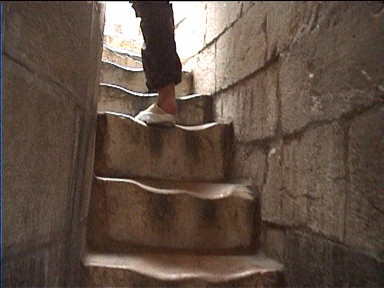 The last flight of stairs up the tower narrow considerably