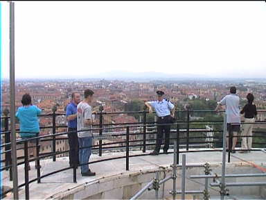 On the top of the Leaning Tower. Police guard all three viewing platforms and tell you when your viewing time is over to return down