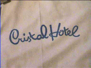 Cristal Hotel logo on bed sheets, the place where we stayed