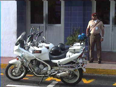 Police guy posing outside Ciudad Bolivar airport
