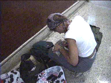 Repacking on the floor of Caracas Airport